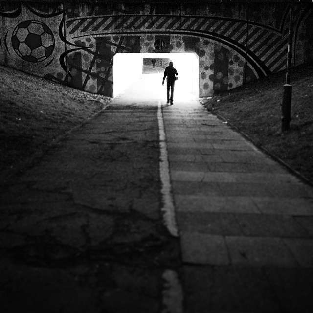 A man walking towards Crawley Town's ground for the game with Doncaster Rovers