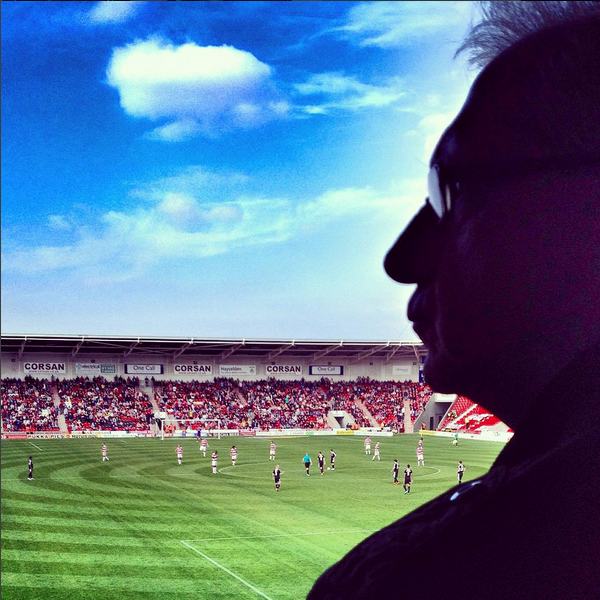 A supporter watches on as Barnsley prepare to kick off in their League One game against Doncaster Rovers at the Keepmoat Stadium