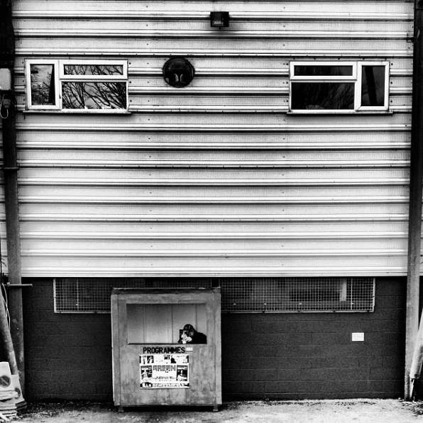 A programme seller outside Yeovil Town's Huish Park stadium.