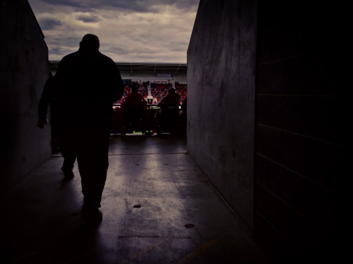 A Doncaster Rovers supporter heads into the Keepmoat Stadium for the second half of his team's 3-1 defeat to Exeter City