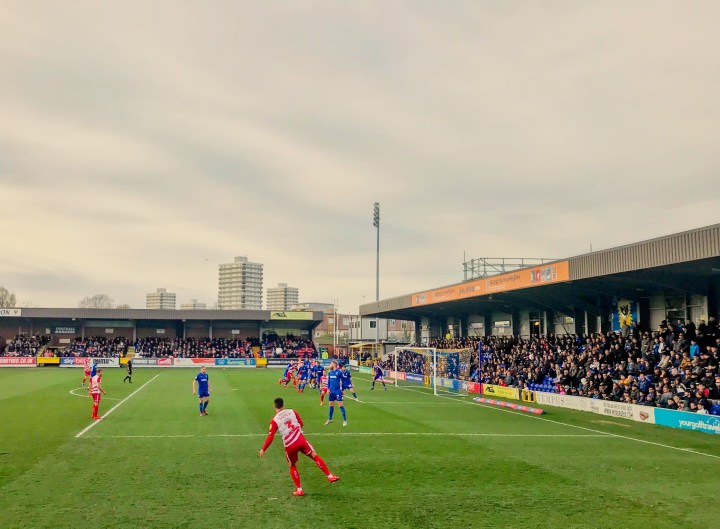 Danny Andrew takes a free-kick during Rovers defeat at Kingsmeadow in the League One fixture
