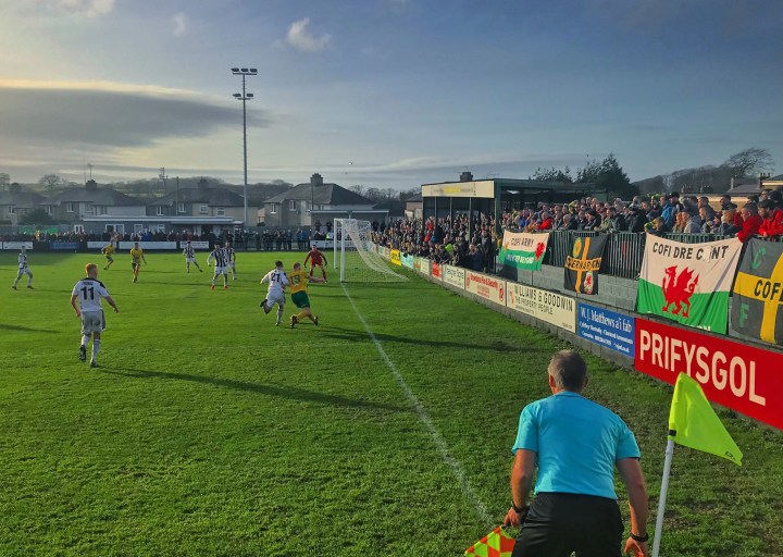 Home fans watch their side on the attack during the Welsh Premier League fixture at The Oval
