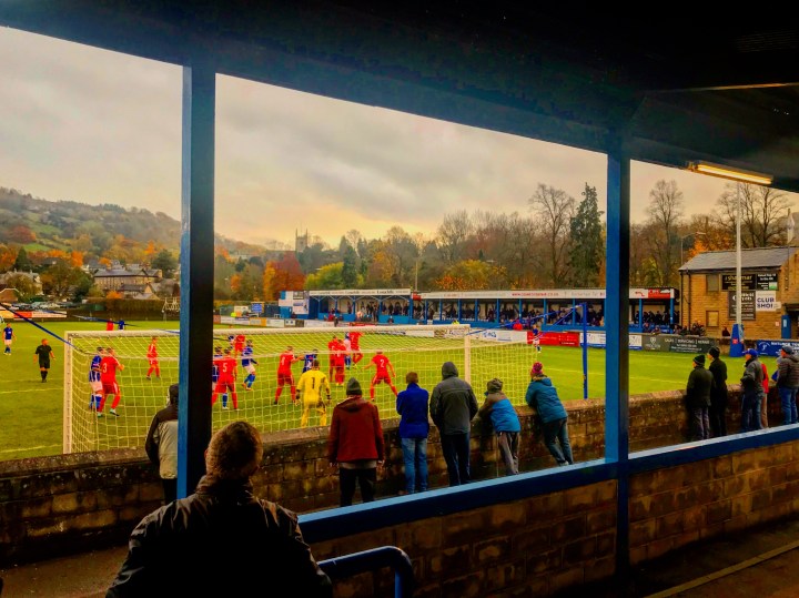 Supporters watch on as Bamber Bridge defend a long throw-in at Causeway Lane