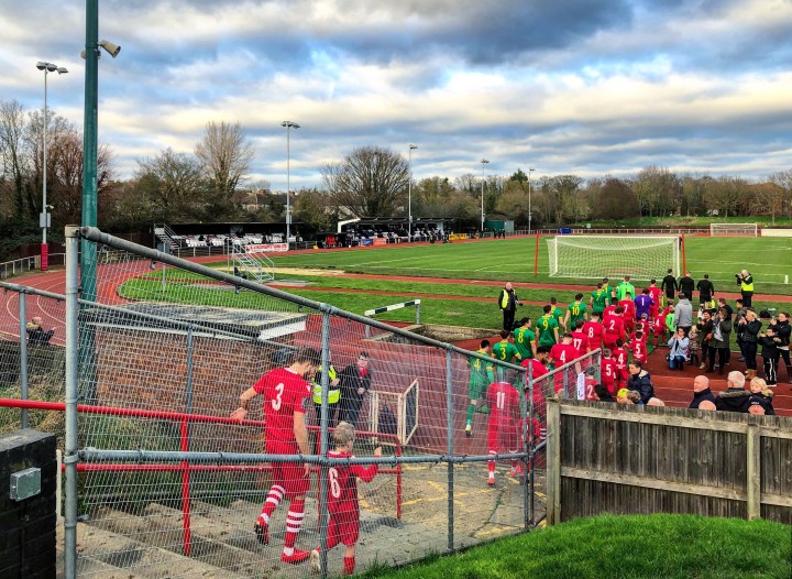 The players enter the field at Hornchurch Stadium for AFC Hornchurch v Horsham