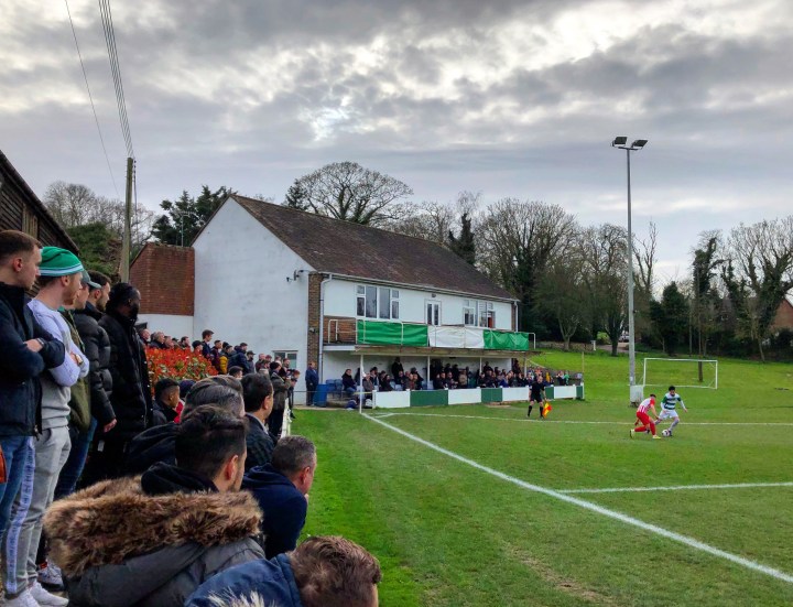 Corinthian supporters watch their team on the attack against Leighton Town in the FA Vase