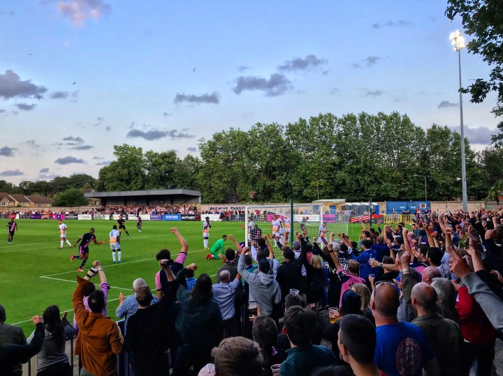 Dulwich Hamlet fans celebrate their team's goal against Wealdstone in their first home game of the 2019-20 season