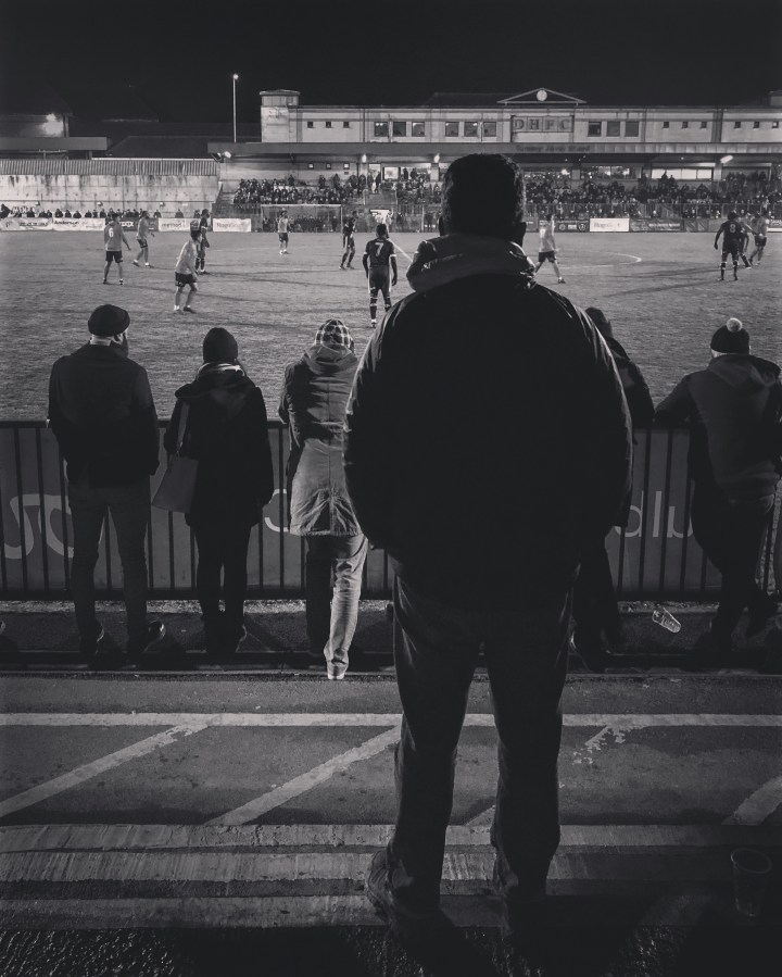 A Dulwich Hamlet fan watches their home game against Havant & Waterlooville