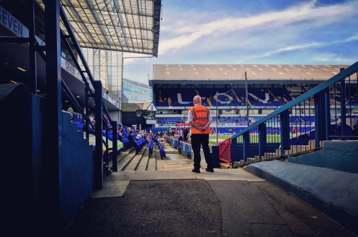 A steward watches on as Portman Road fills up for Ipswich Town against Doncaster Rovers