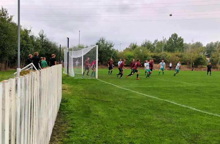 A Mochdre Sports forward gets ready to attempt an overhead kick at goal during a match against Bro Cernyw