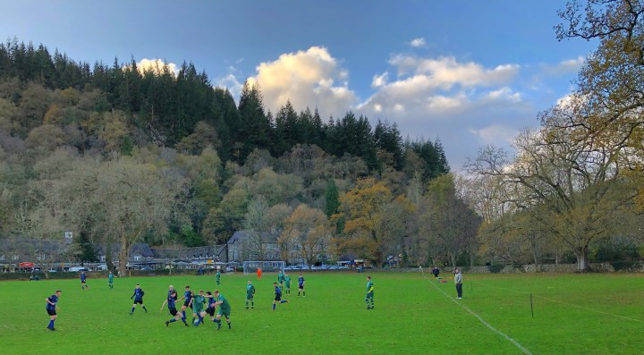 Betws-y-Coed play Llanelwy Athletic in front of a backdrop of autumn trees and woodland