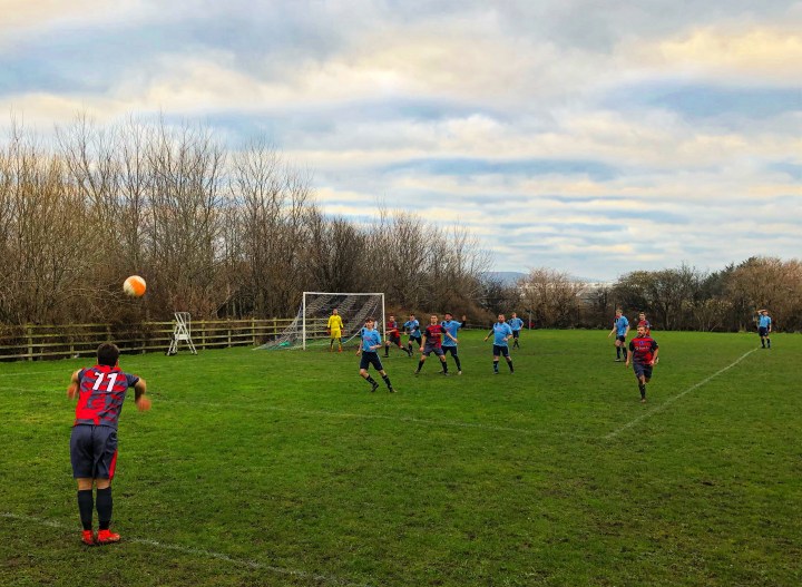 Mochdre Sports number 11 takes a throw in during a match against Kinmel Bay