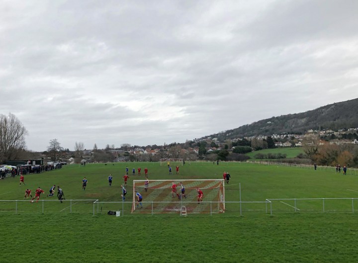 A view from high behind one goal as Prestatyn Sports attack against Meliden
