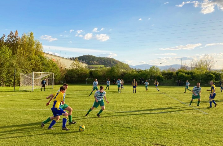 Long shadows on the pitch as Mochdre Sports take on Penmaenmawr Phoenix in a late spring evening fixture