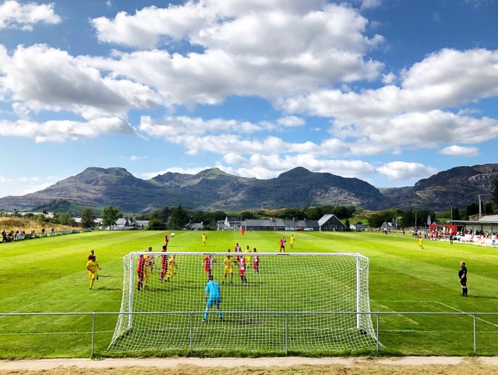 Blaenaue Ffestiniog Amateurs take on Llay Welfare at the Cae Clyd ground with the mountains of Snowdonia in the background