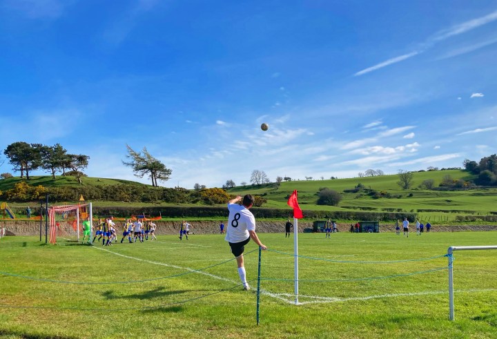 A Llannefydd player takes a corner kick against Penmaenmawr Phoenix