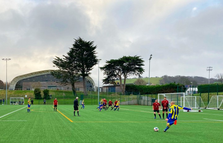 Penmaenmawr Phoenix's number 11 strikes a free-kick against Abergele on the artificial pitch at Parc Eirias
