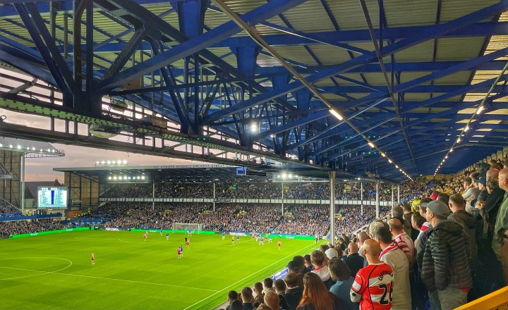 Doncaster Rovers fans in the upper tier at Goodison Park watch their team on the attack against Everton