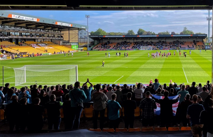 Doncaster Rovers fans applaud their team as they leave the field following a 3-2 win at Port Vale
