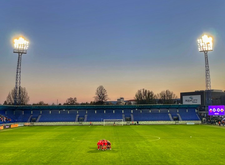 Wales women form an on-field huddle before their match against Slovakia in Poprad