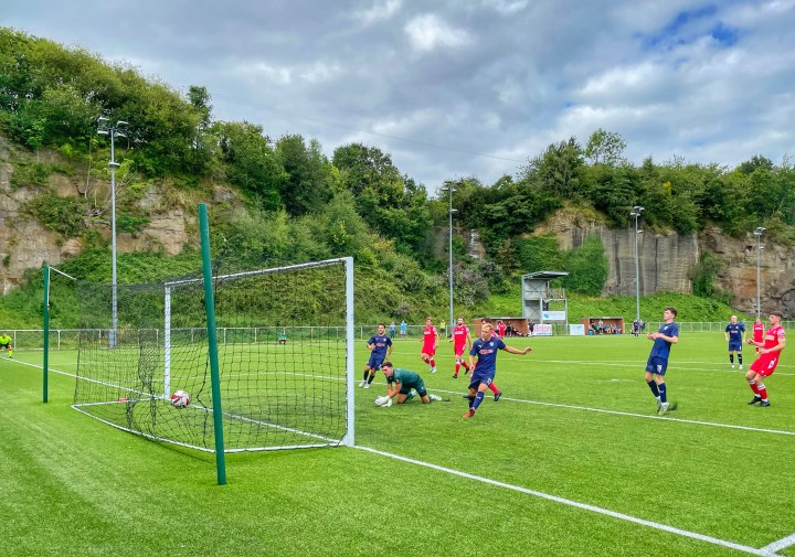 Airbus score on the rebound from a saved penalty against Gresford Athletic at The Rock