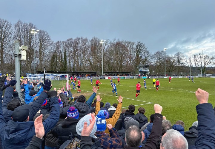 Bangor City supporters celebrate their second goal at a packed Nantporth during their FAW Welsh Cup quarter final win over Caerau Ely.