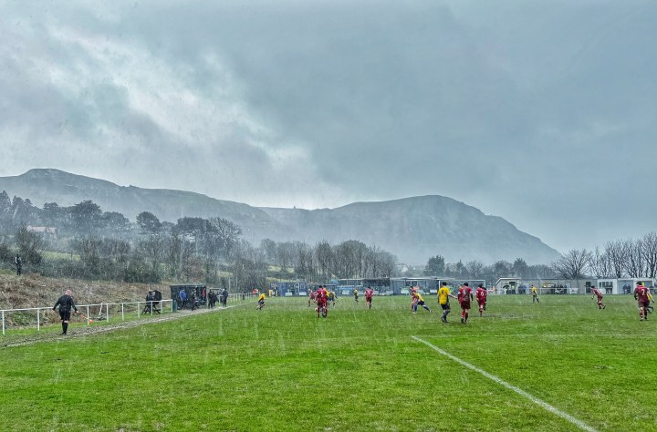 Torrential rain falls on Penmaenmawr Phoenix and Llannefydd players during their ultimately abandoned FAW Welsh Amateur Trophy quarter final match.